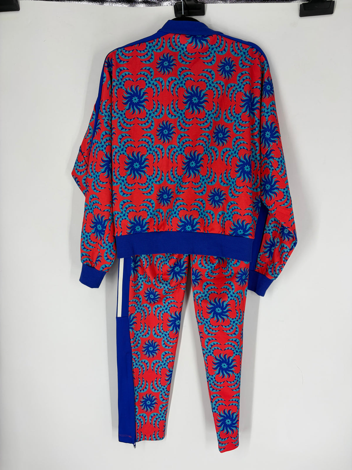 Red Adidas patterned track suit, XS