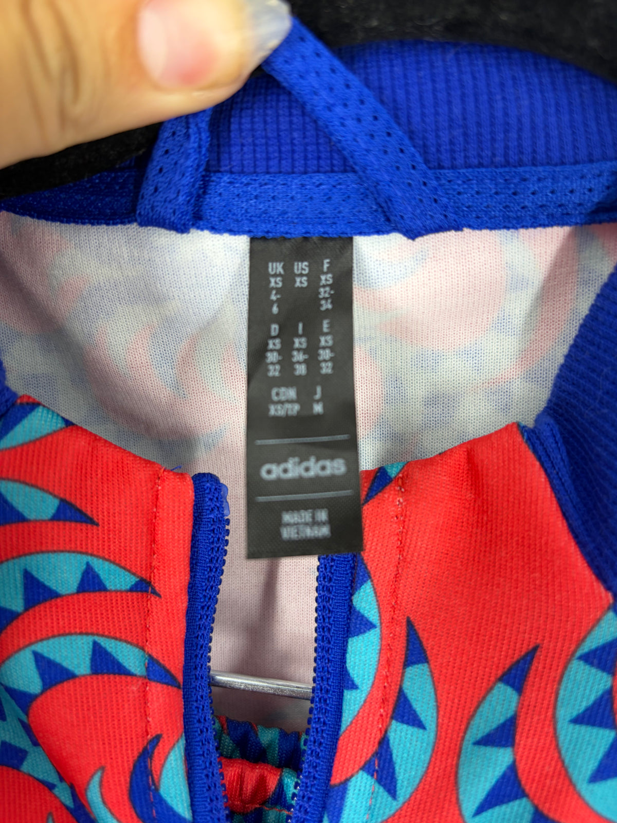 Red Adidas patterned track suit, XS
